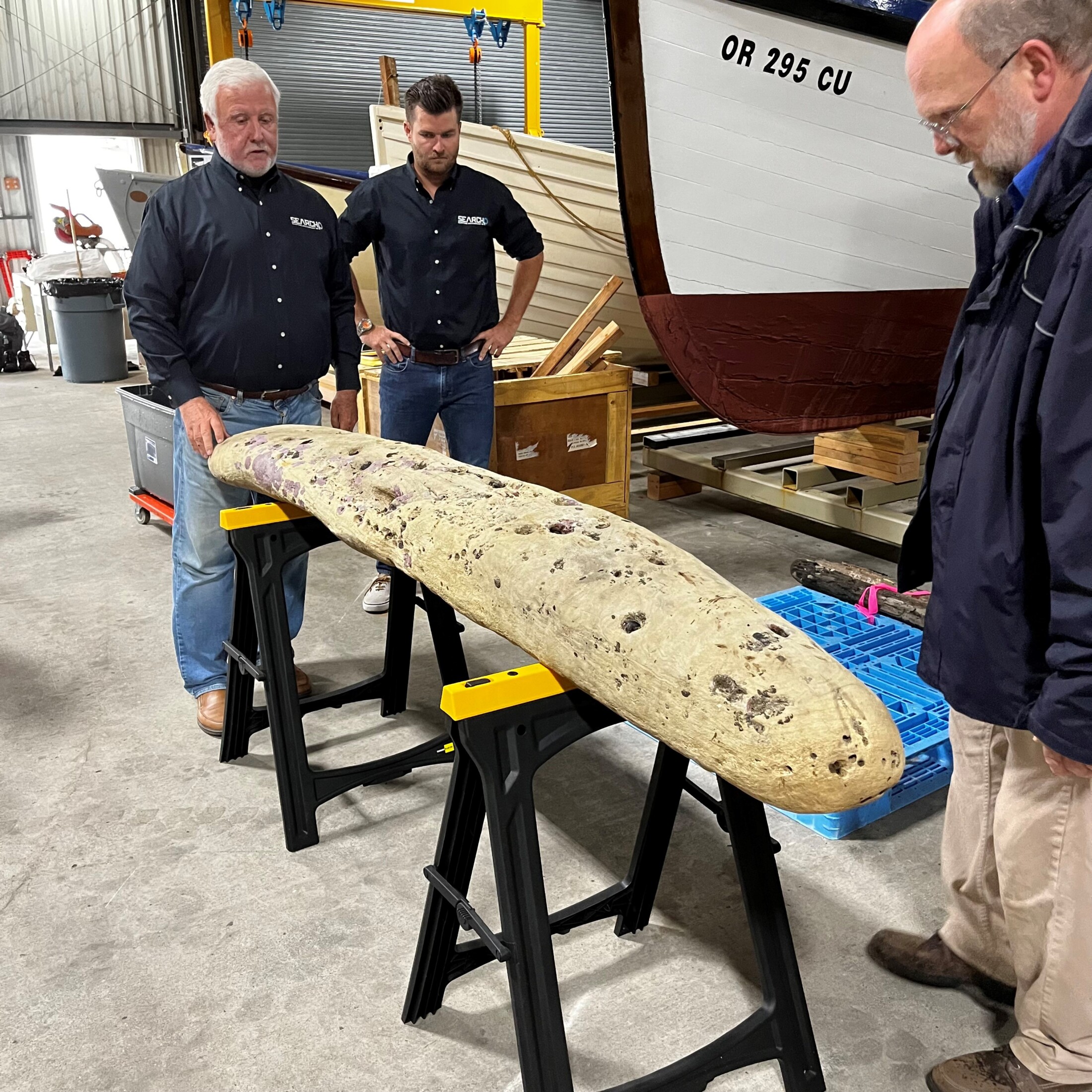 Examining One of the Ship Timbers Recovered From The Sea Caves In 2023 With Kyle Lent Of SEARCH And Jeff Smith, Curator Of The Columbia River Maritime Museum