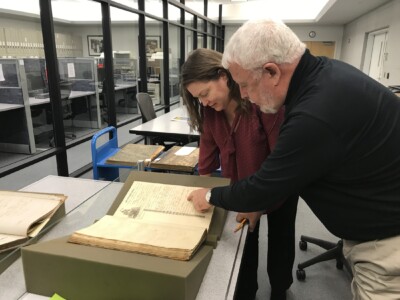 Alabama State Archaeologist Stacye Hathorn and Jim Examine Clotilda's Original Registry Documents at The National Archives