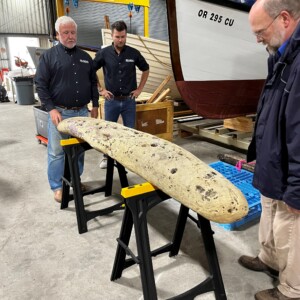 Examining One of the Ship Timbers Recovered From The Sea Caves In 2023 With Kyle Lent Of SEARCH And Jeff Smith, Curator Of The Columbia River Maritime Museum